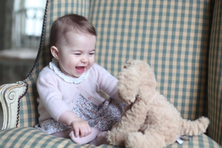 The Princess is enjoying her cuddly toy. (the Duchess of Cambridge)