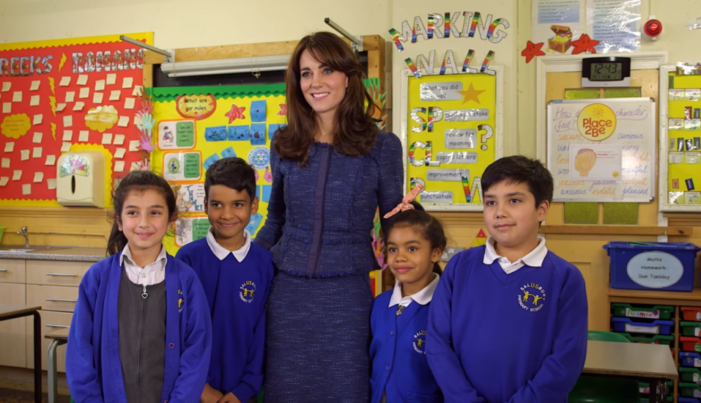 The Duchess of Cambridge poses for a photo with the four pupils in the video. Place2Be