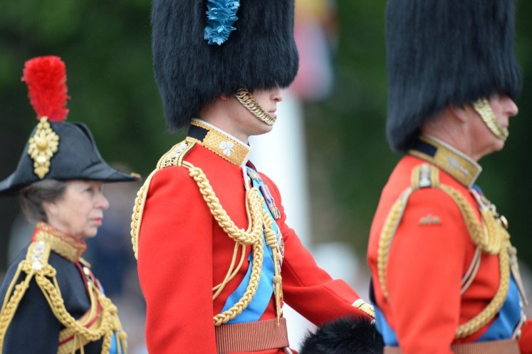 Prince William, Princess Anne and Prince Charles ride horseback during the parade, as Royal Colonels of the Irish, and Welsh Guards, and the Blues and Royals.